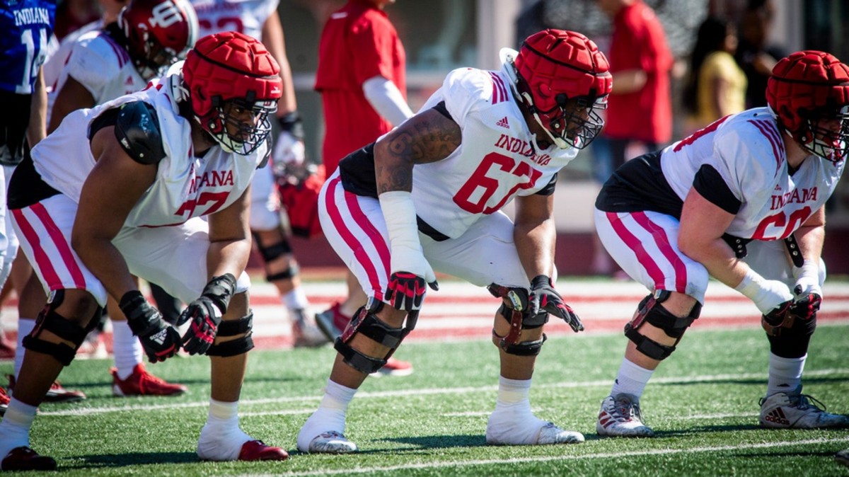 Indiana linemen Joshua Sales Jr. (77), Kalil Benson (67) and Max Longman (60) prepare for a snap during Indiana football's Spring Football Saturday event at Memorial Stadium on Saturday, April 15, 2203.